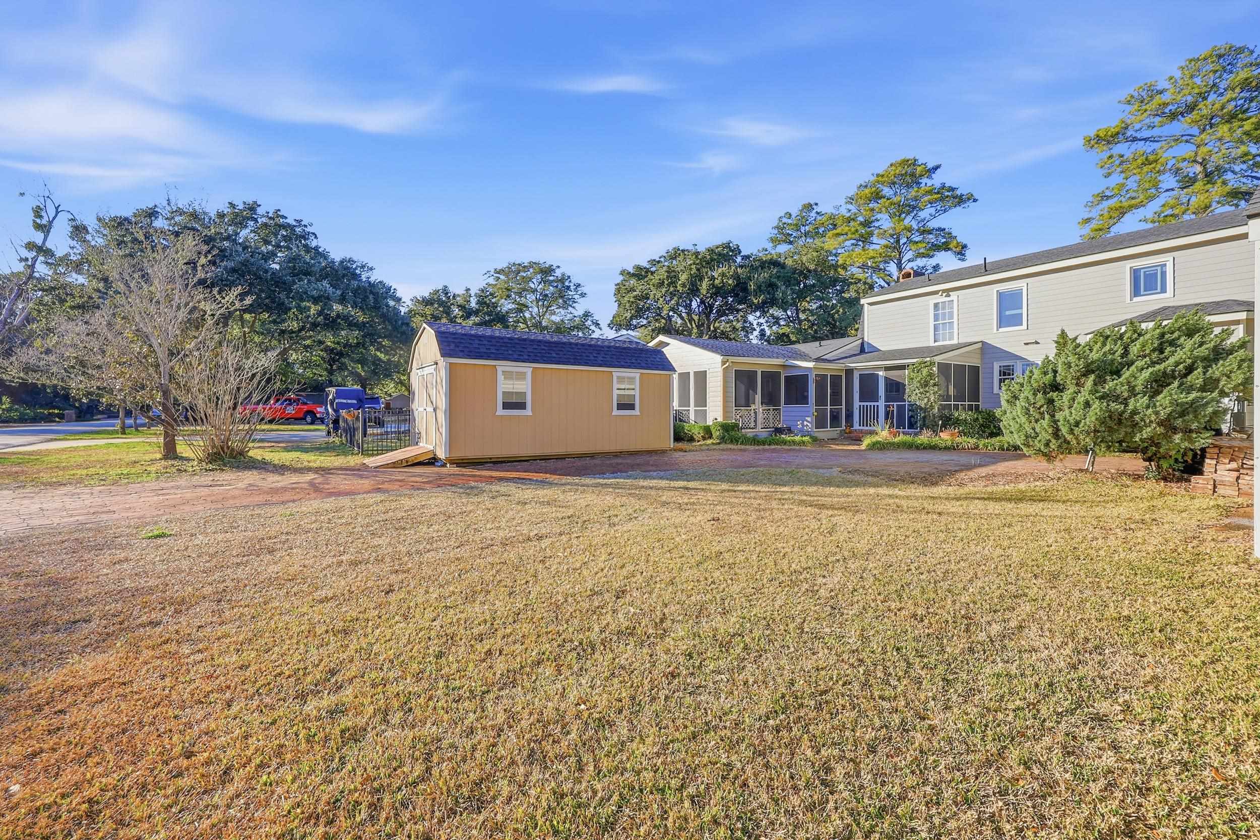 709 Mt Gilead Road Murrells Inlet, SC 29576 - Photo 33 of 38 Back of house with a yard and a sunroom