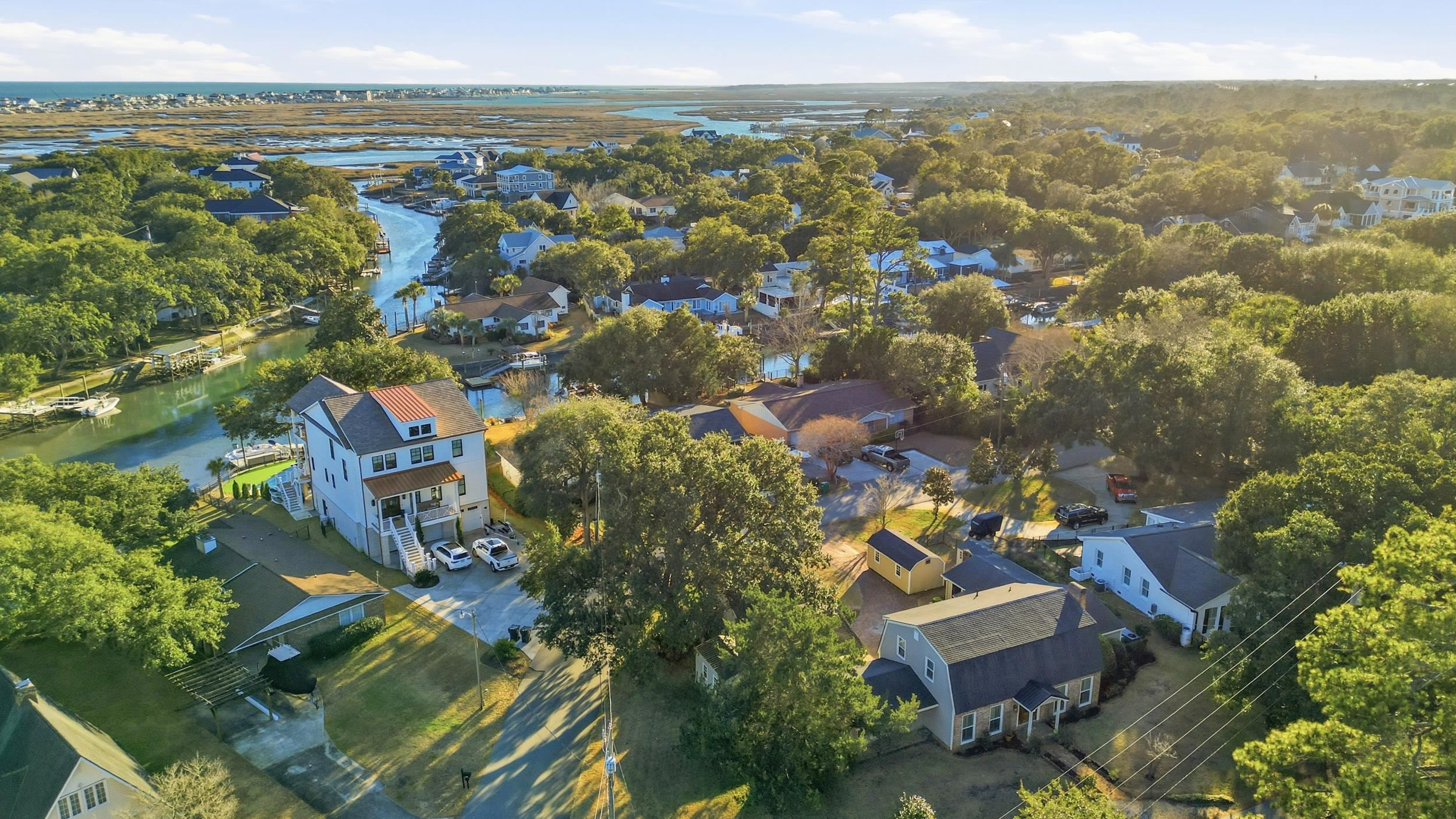 709 Mt Gilead Road Murrells Inlet, SC 29576 - Photo 37 of 38 Aerial perspective of suburban area with a large body of water