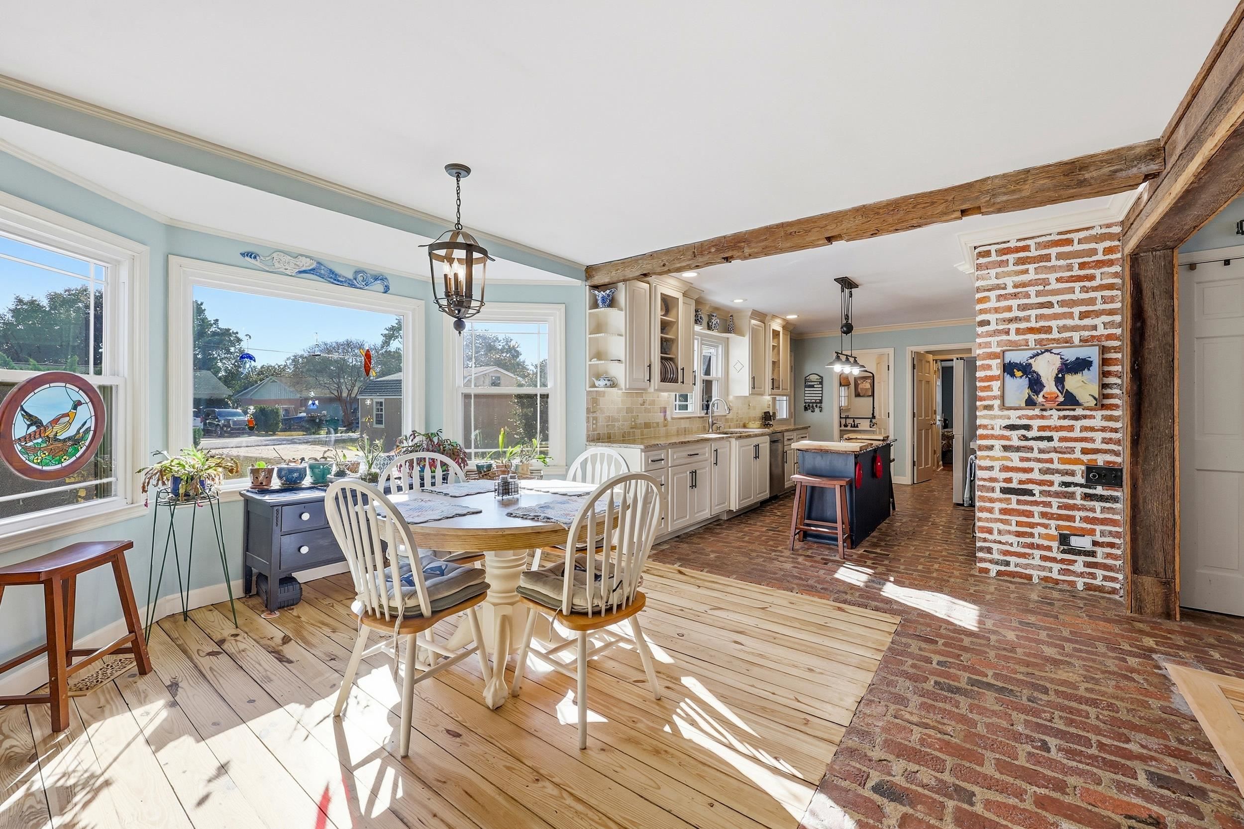 709 Mt Gilead Road Murrells Inlet, SC 29576 - Photo 8 of 38 Dining space featuring ornamental molding and a chandelier