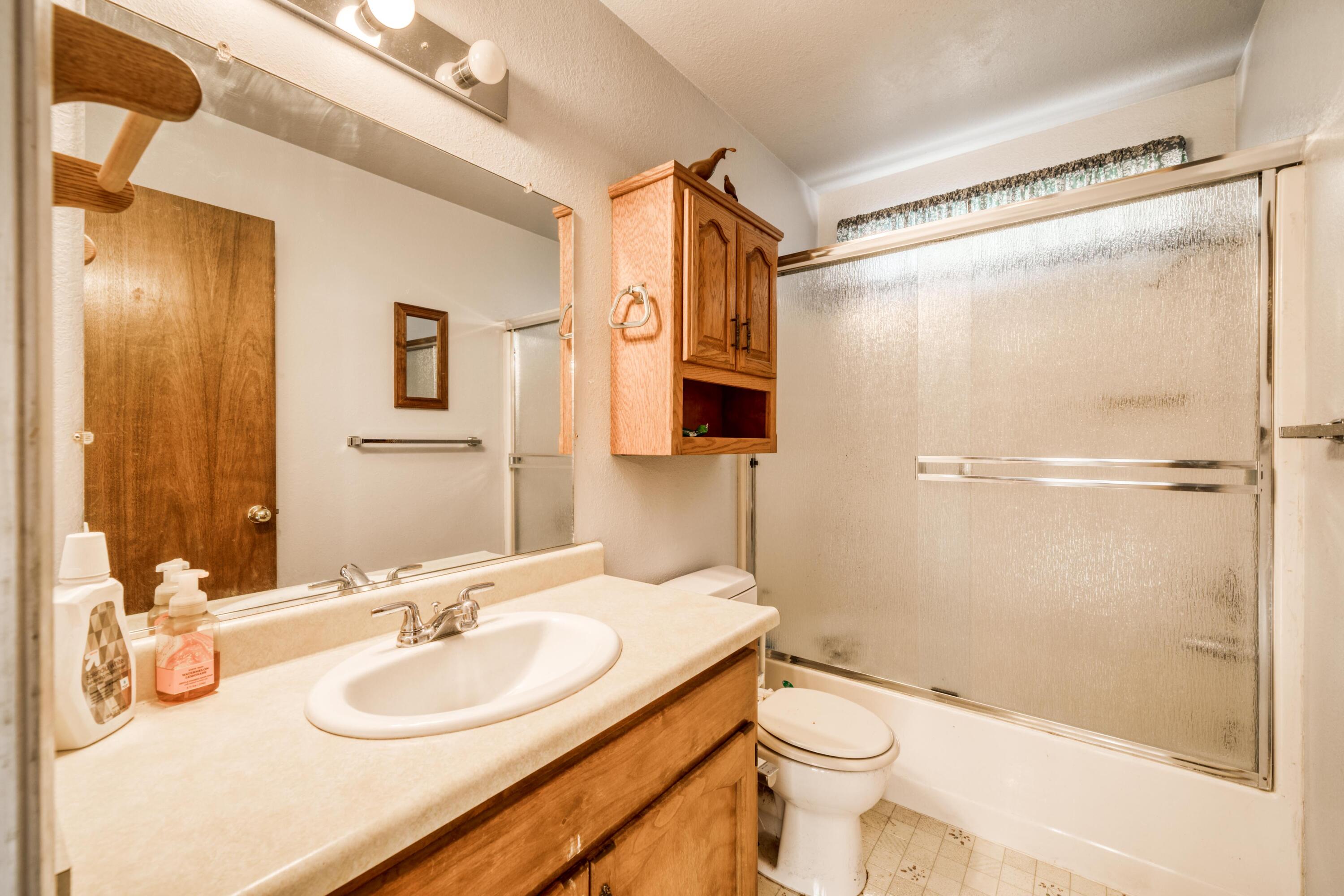 2274 Jessica Way Redding, CA 96002 - Photo 11 of 18 a bathroom with a sink toilet and shower