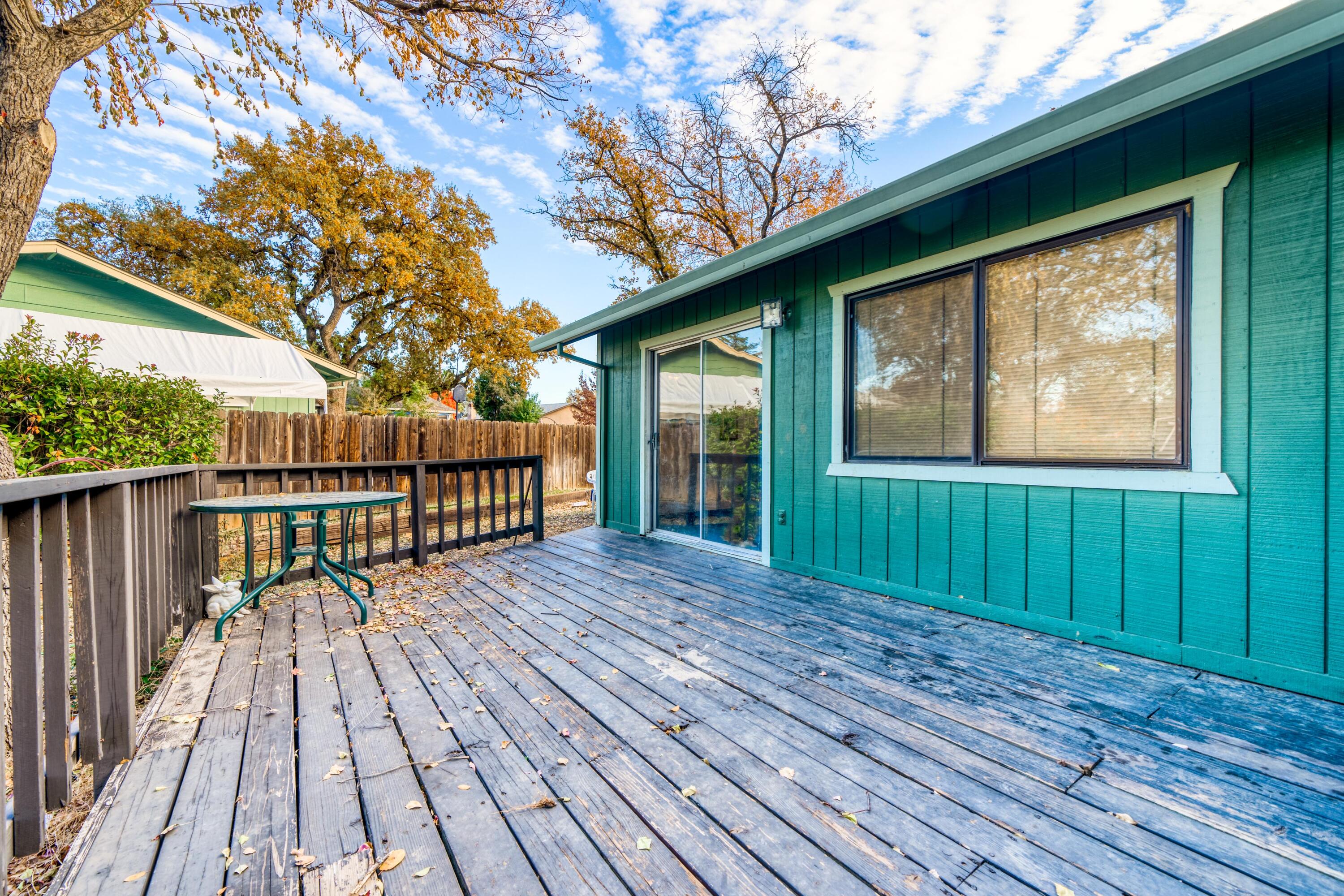 2274 Jessica Way Redding, CA 96002 - Photo 14 of 18 a view of backyard with deck and wooden floor