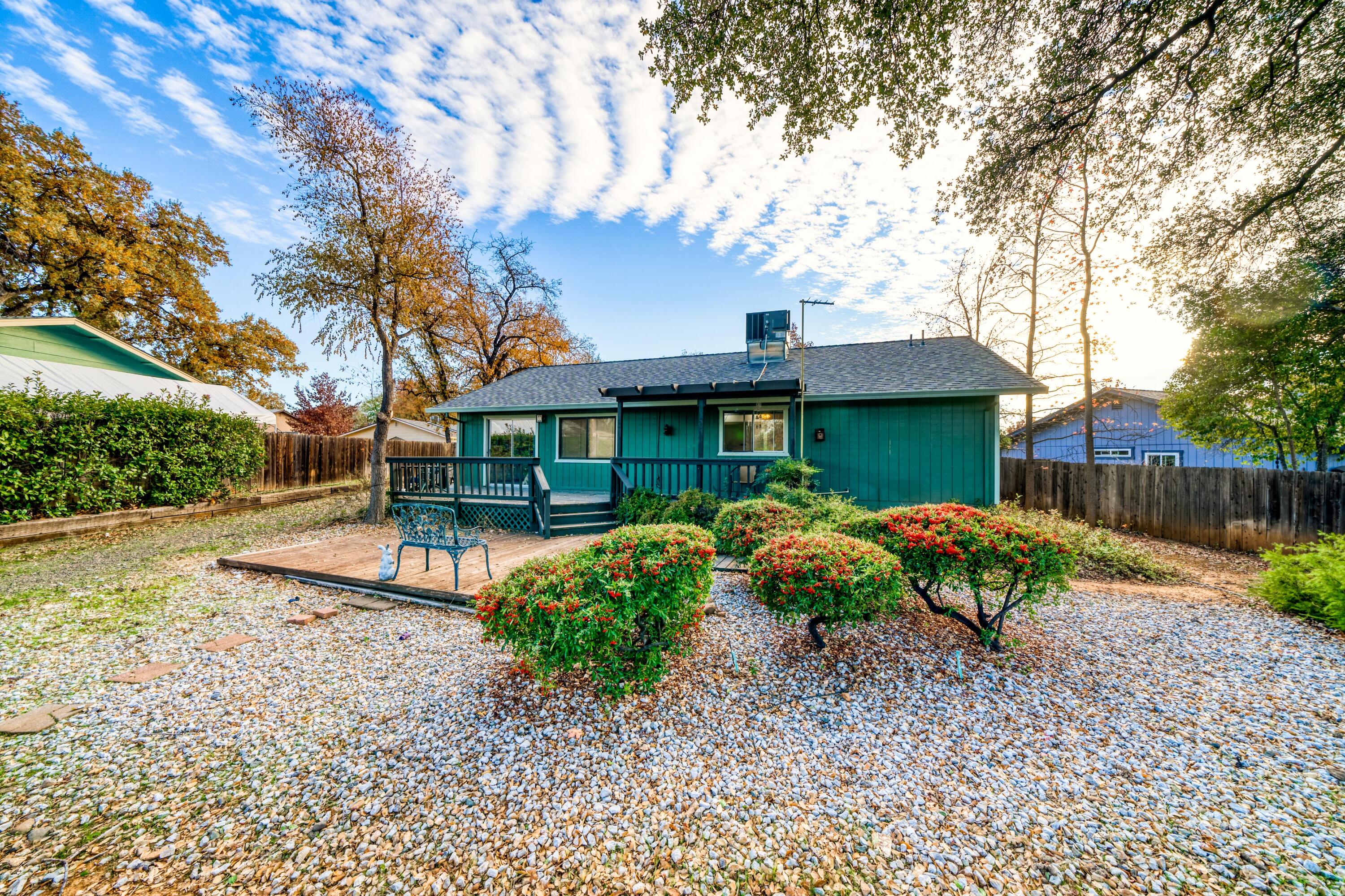 2274 Jessica Way Redding, CA 96002 - Photo 16 of 18 a view of a house with backyard and sitting area