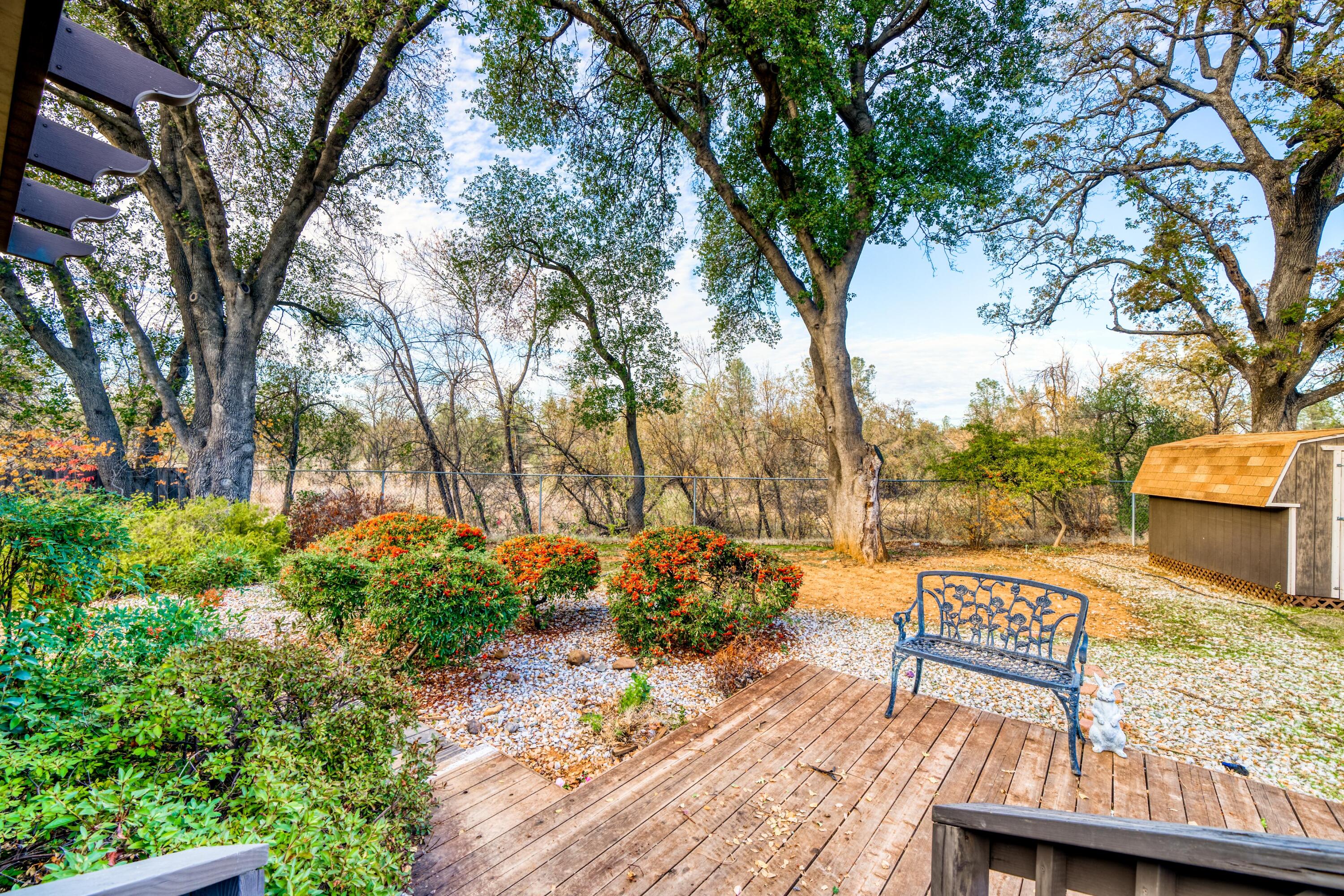 2274 Jessica Way Redding, CA 96002 - Photo 2 of 18 a view of a patio with table and chairs and potted plants