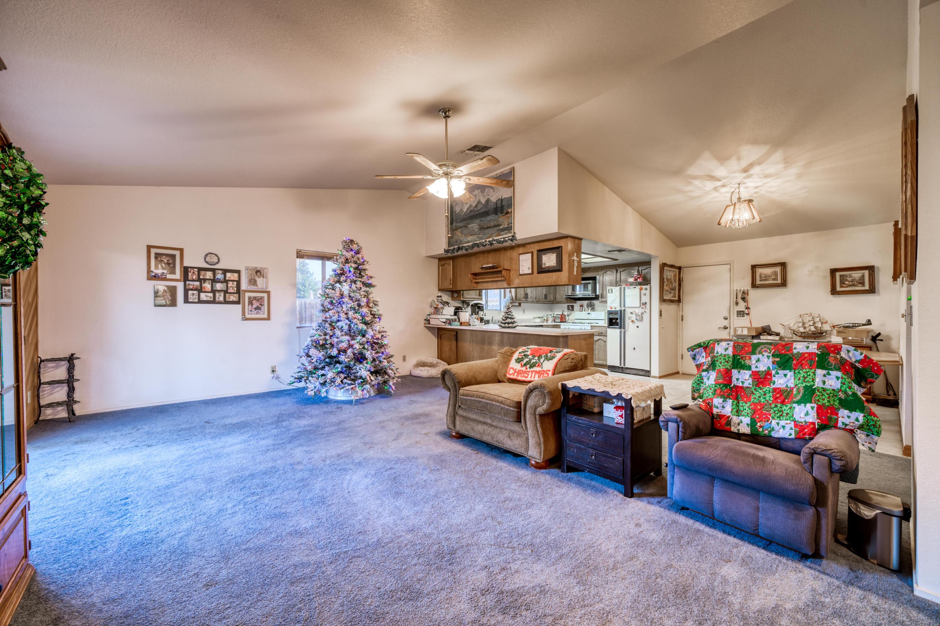 2274 Jessica Way Redding, CA 96002 - Photo 6 of 18 a living room with furniture and a garage