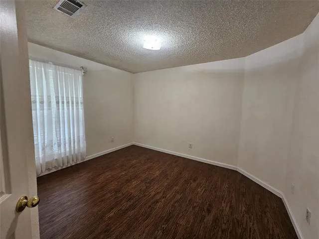 a bathroom with a shower and toilet