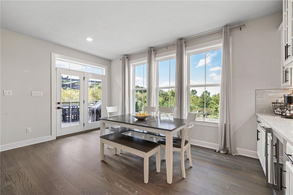 313 Crest Lane Mars, PA 16046 - Photo 19 of 50 a dining room with wooden floor and a floor to ceiling window