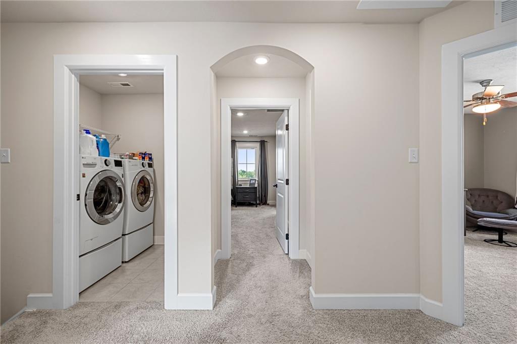 313 Crest Lane Mars, PA 16046 - Photo 30 of 50 a view of a hallway with washer and dryer