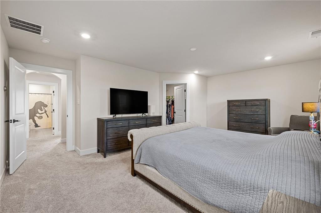 313 Crest Lane Mars, PA 16046 - Photo 32 of 50 a bedroom with a bed and a flat screen tv