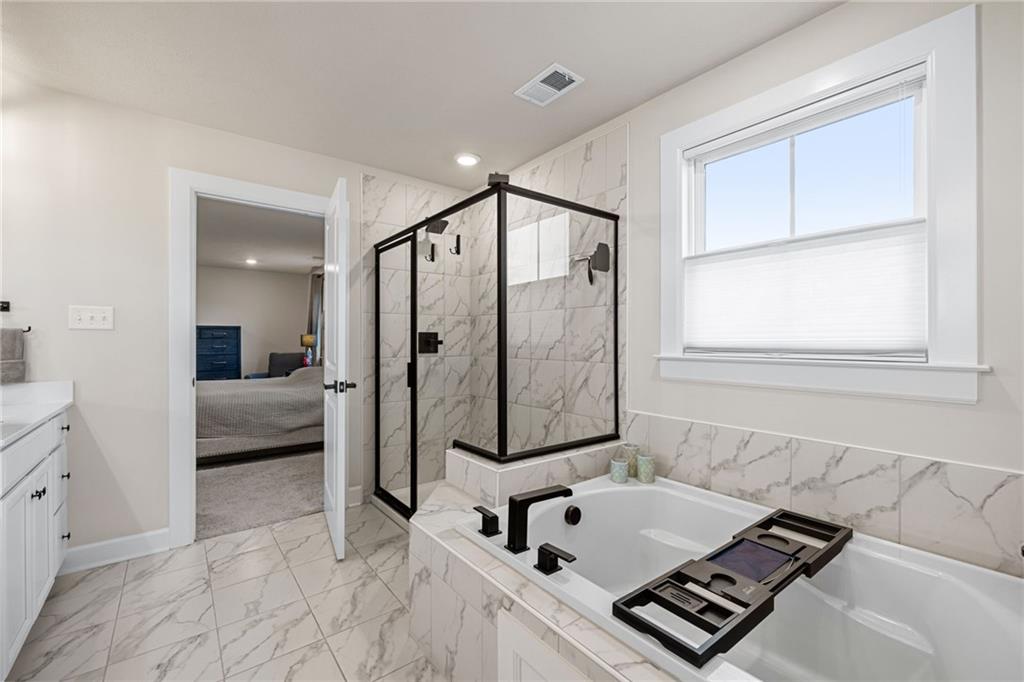 313 Crest Lane Mars, PA 16046 - Photo 35 of 50 a bathroom with a tub sink vanity and mirror