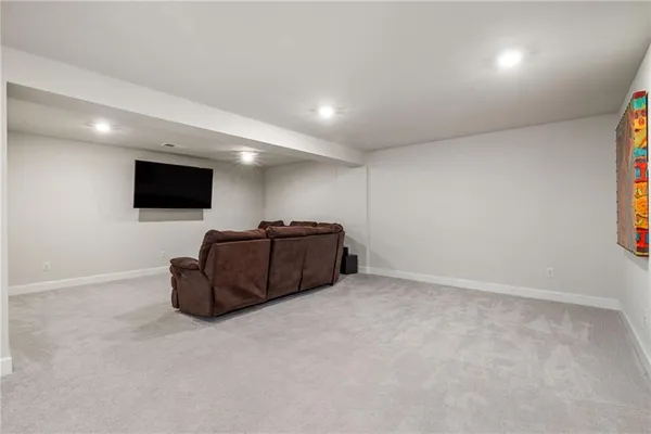 a view of a room with furniture and white walls