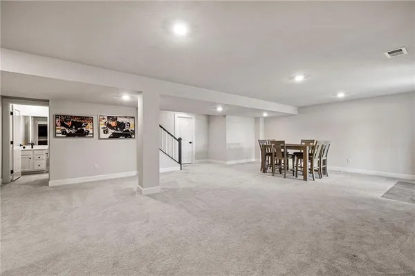 a bathroom with a toilet a sink and a mirror