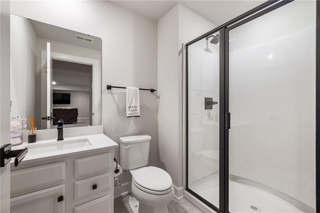 313 Crest Lane Mars, PA 16046 - Photo 40 of 50 a bathroom with a toilet a sink and a mirror