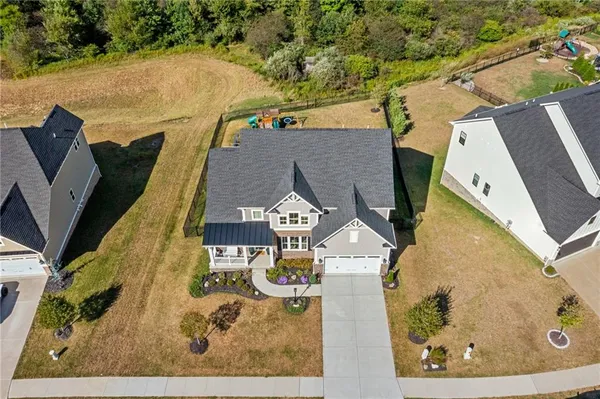 a aerial view of a house with a yard