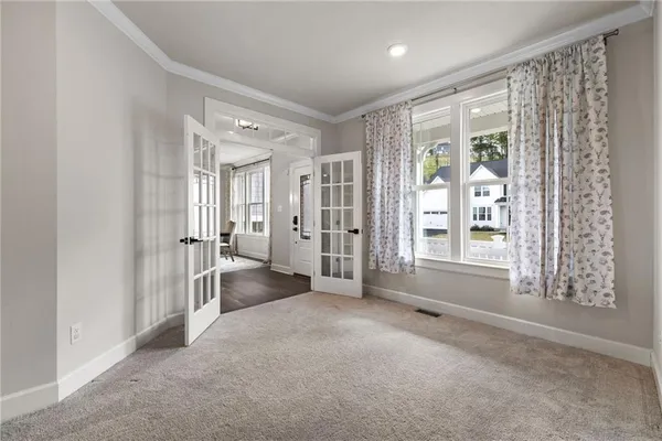 a view of an empty room with a window