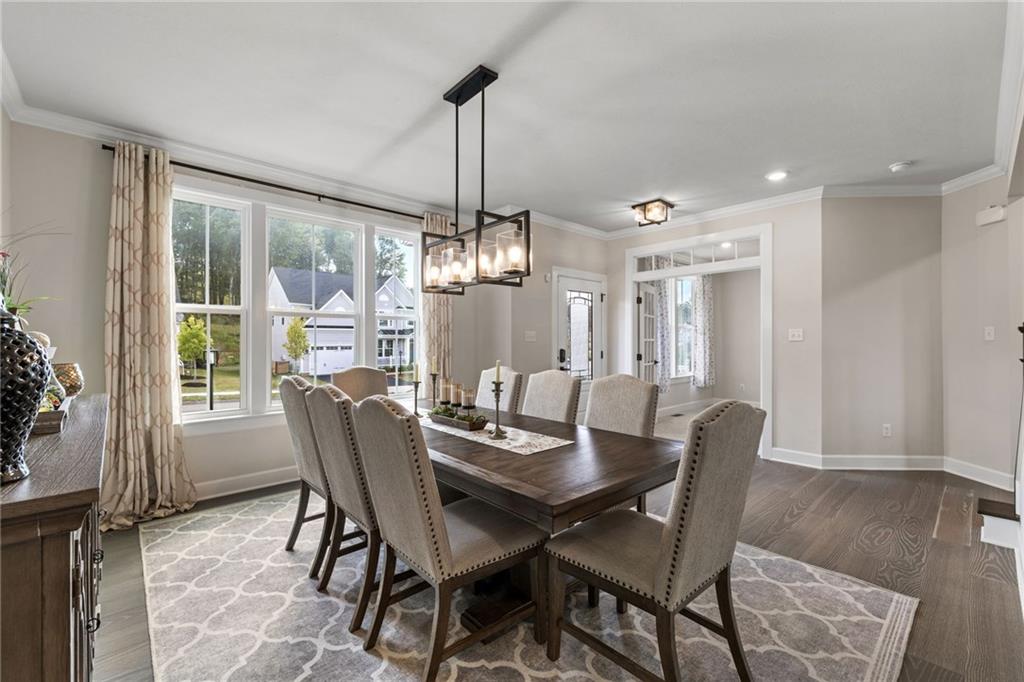 313 Crest Lane Mars, PA 16046 - Photo 6 of 50 a view of a dining room with furniture window and wooden floor
