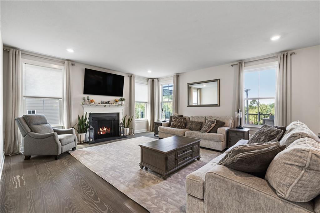 313 Crest Lane Mars, PA 16046 - Photo 9 of 50 a living room with furniture a fireplace and a flat screen tv