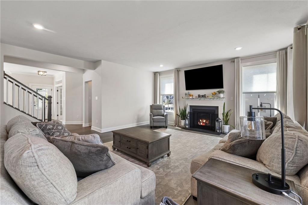 313 Crest Lane Mars, PA 16046 - Photo 10 of 50 a living room with furniture a flat screen tv and a fireplace
