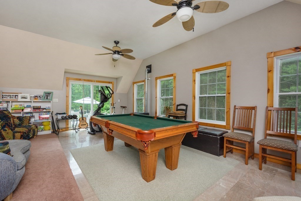 132 Fowler Road Northbridge, MA 01534 - Photo 23 of 42 a room with furniture and a chandelier