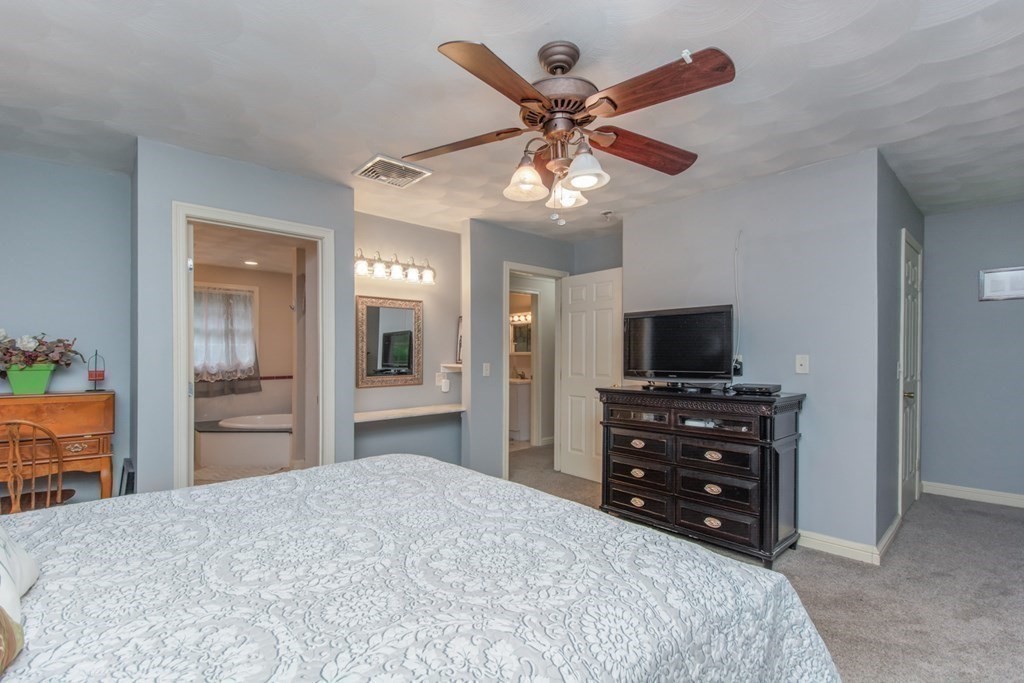 132 Fowler Road Northbridge, MA 01534 - Photo 26 of 42 a bedroom with a bed and a flat screen tv