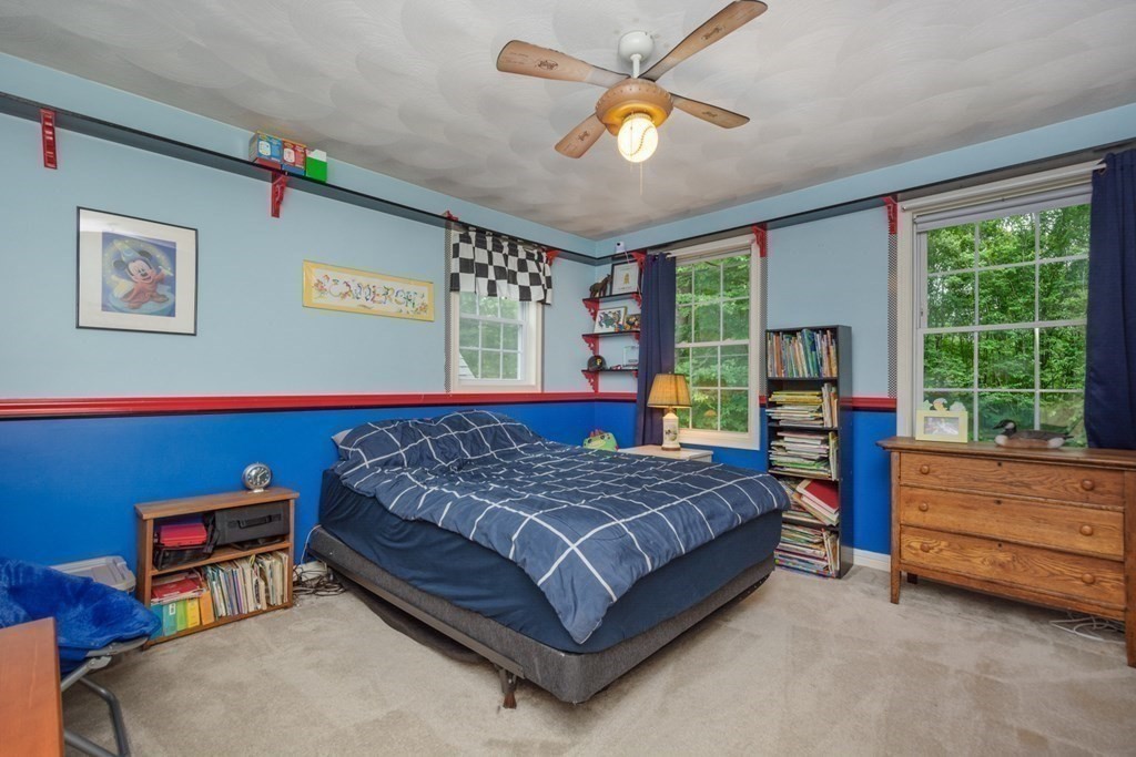 132 Fowler Road Northbridge, MA 01534 - Photo 30 of 42 a bedroom with a bed and a table