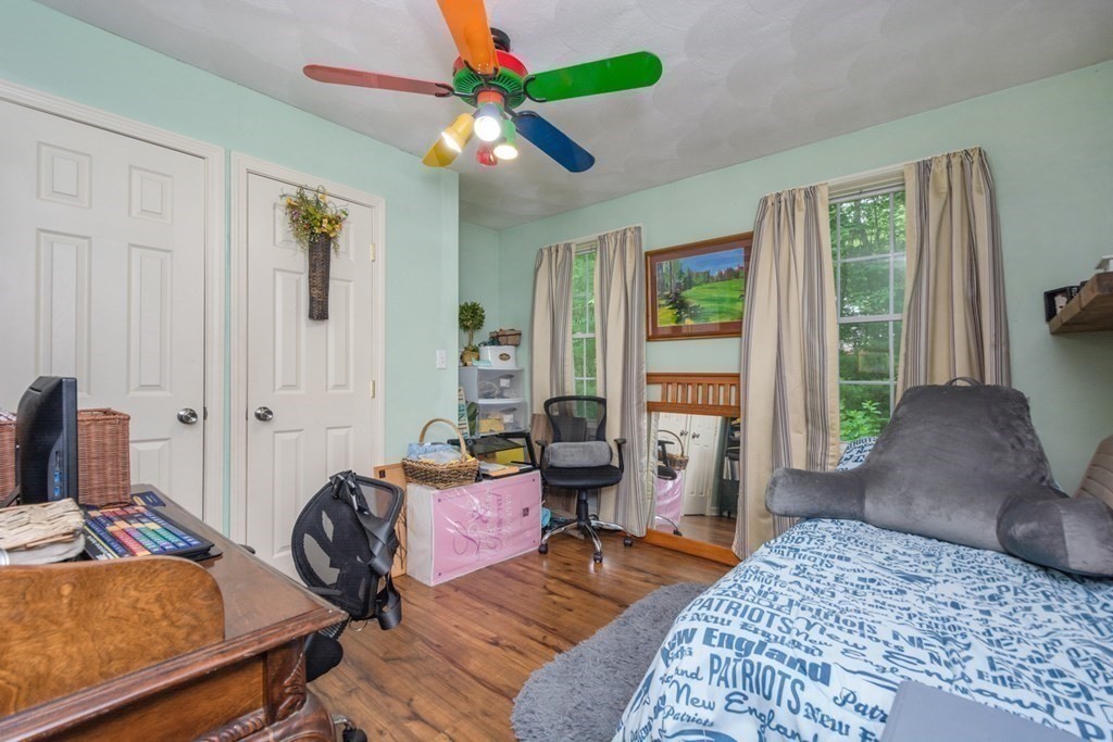 132 Fowler Road Northbridge, MA 01534 - Photo 32 of 42 a bedroom with a bed and wooden floor