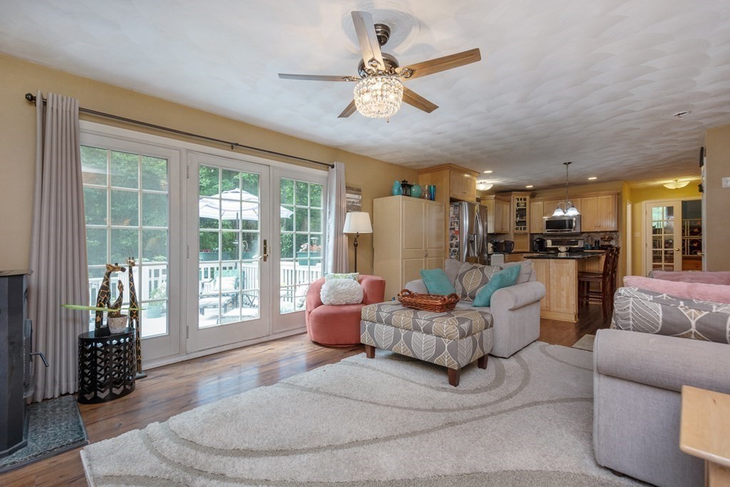 132 Fowler Road Northbridge, MA 01534 - Photo 7 of 42 a living room with furniture and a large window with kitchen view