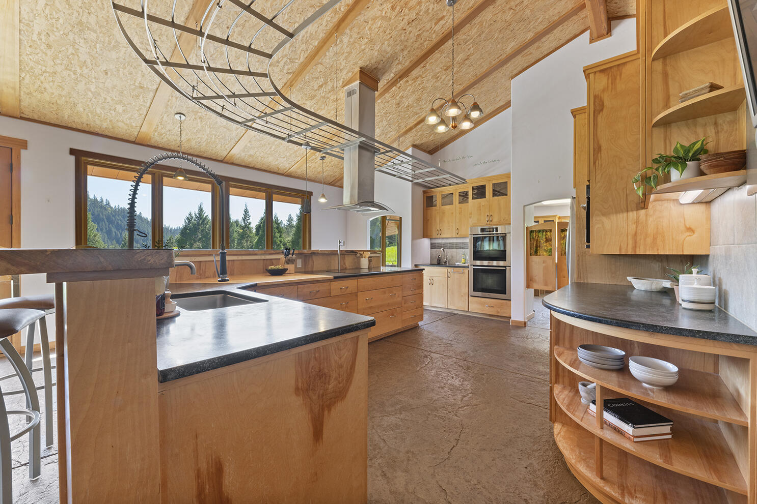 1104 Upper Cow Creek Road Azalea, OR 97410 - Photo 11 of 77 a kitchen with stainless steel appliances granite countertop a sink and a stove