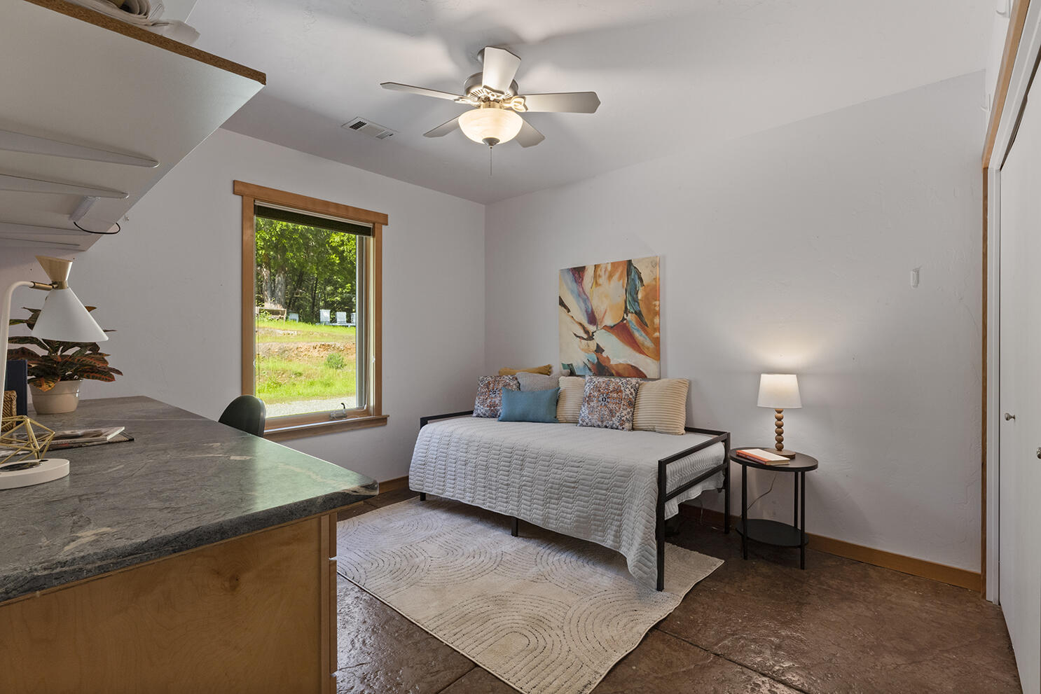 1104 Upper Cow Creek Road Azalea, OR 97410 - Photo 27 of 77 a bedroom with a bed and a chandelier