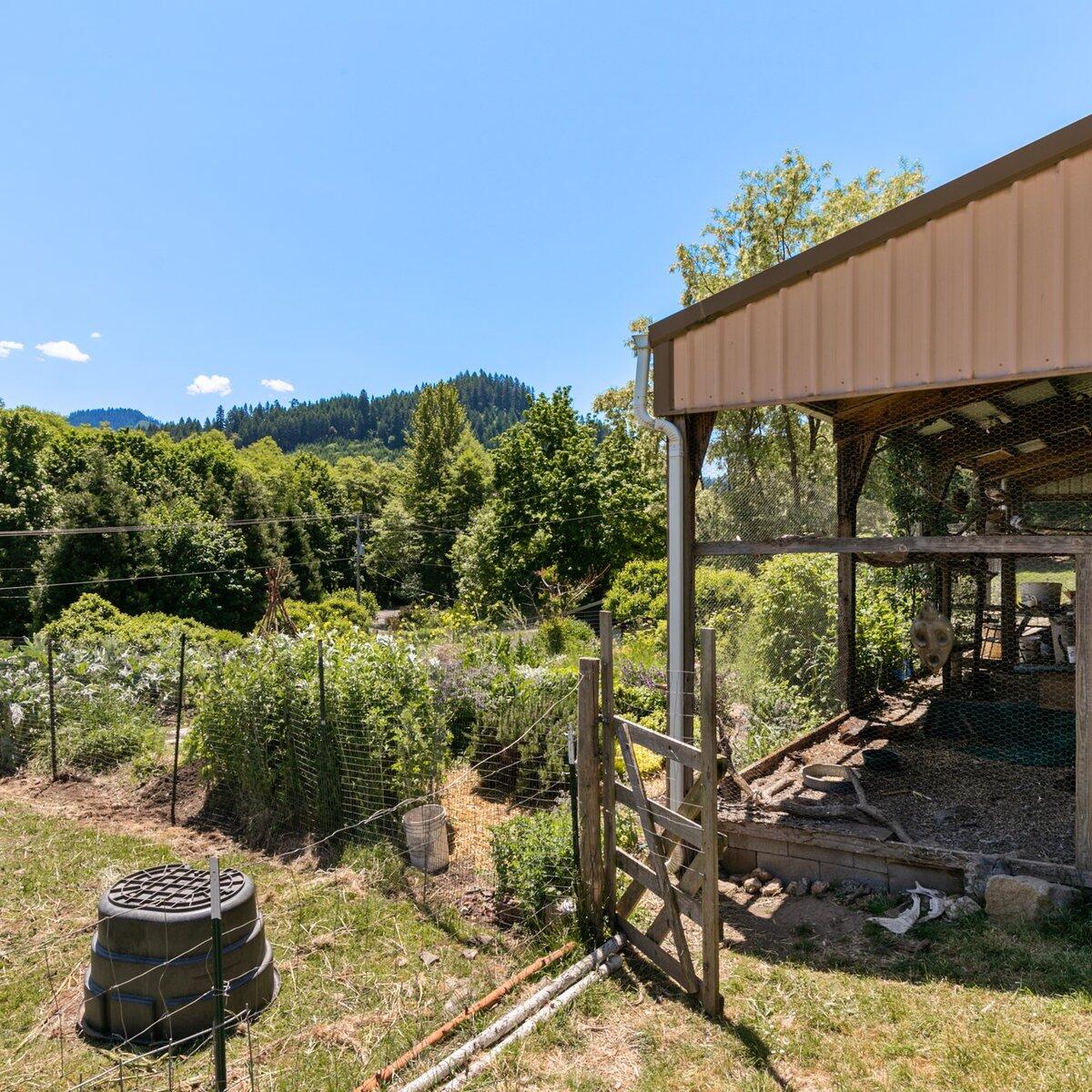 1104 Upper Cow Creek Road Azalea, OR 97410 - Photo 54 of 77 a view of a chairs and table in backyard