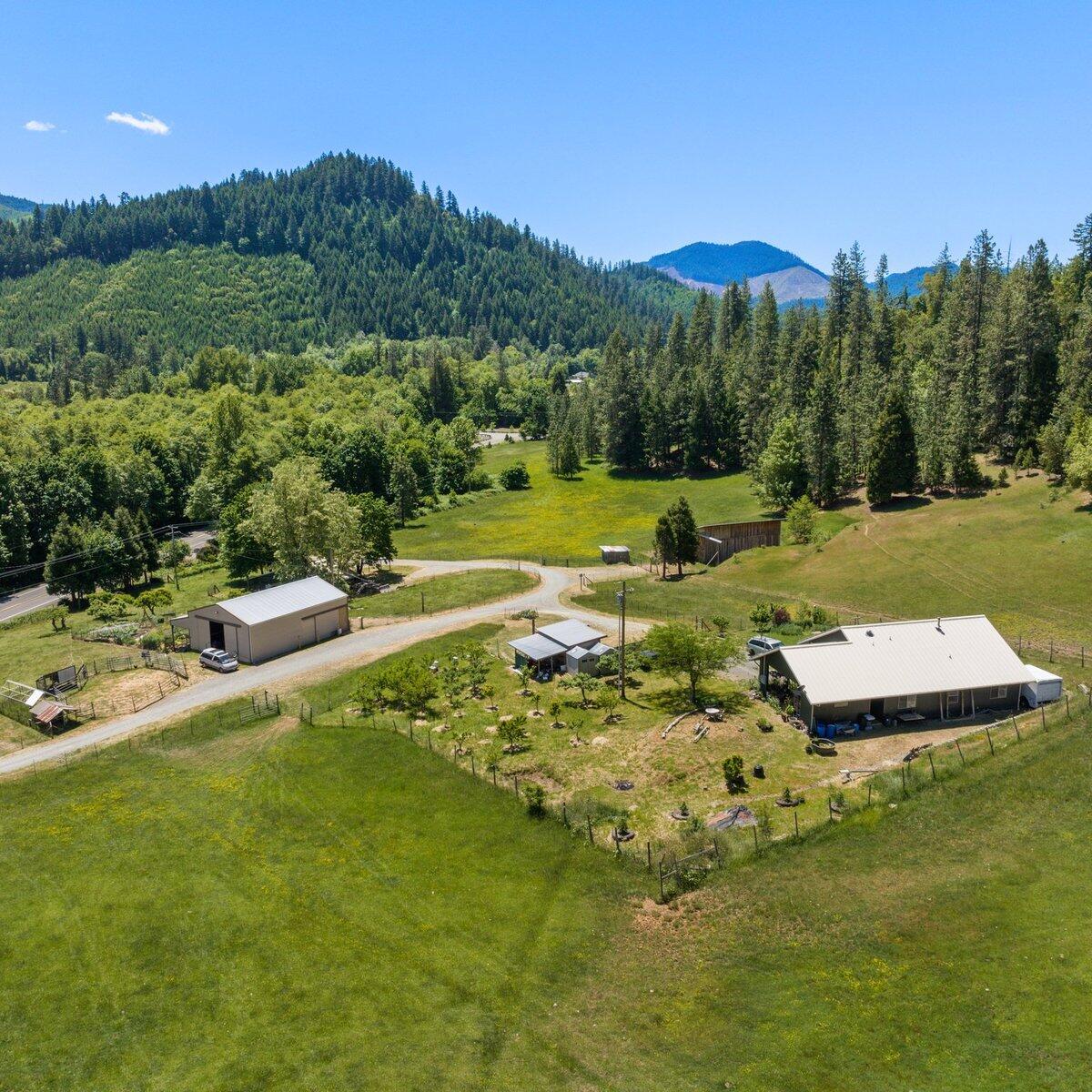 1104 Upper Cow Creek Road Azalea, OR 97410 - Photo 65 of 77 a view of a golf course with a lake view
