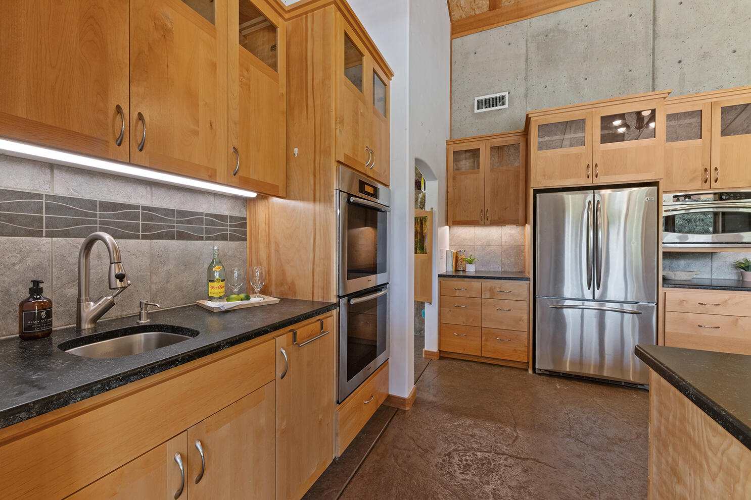 1104 Upper Cow Creek Road Azalea, OR 97410 - Photo 8 of 77 a kitchen with stainless steel appliances granite countertop a refrigerator and a sink