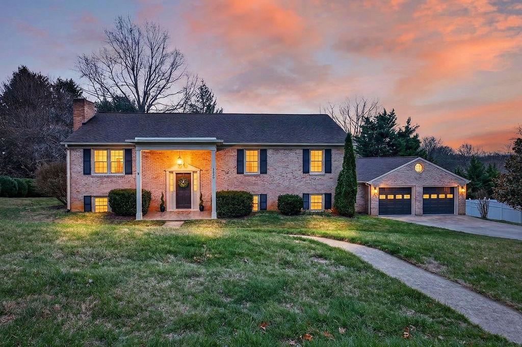 224 Meadowbrook Road Staunton, VA 24401 - Photo 1 of 59 a view of a house with a big yard and large trees