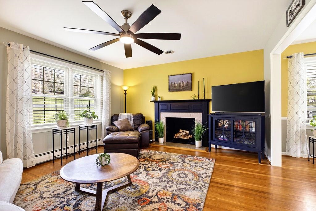 224 Meadowbrook Road Staunton, VA 24401 - Photo 11 of 59 a living room with furniture a flat screen tv and a fireplace