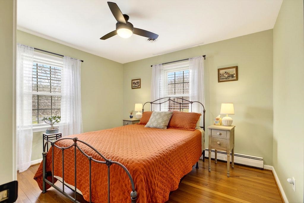 224 Meadowbrook Road Staunton, VA 24401 - Photo 19 of 59 a bedroom with a bed and wooden floor