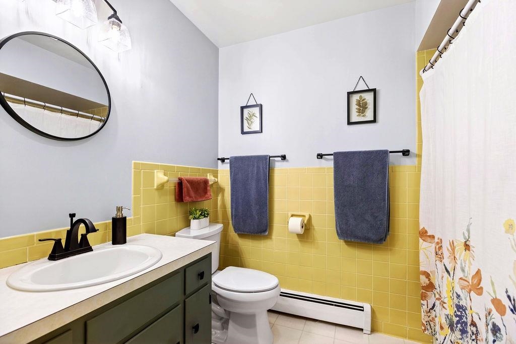 224 Meadowbrook Road Staunton, VA 24401 - Photo 23 of 59 a bathroom with a toilet sink and mirror