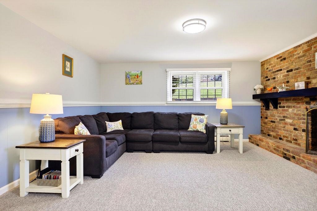 224 Meadowbrook Road Staunton, VA 24401 - Photo 29 of 59 a living room with furniture a fireplace and a window