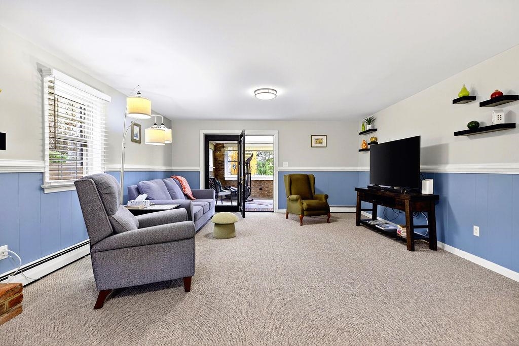 224 Meadowbrook Road Staunton, VA 24401 - Photo 31 of 59 a living room with furniture and a flat screen tv