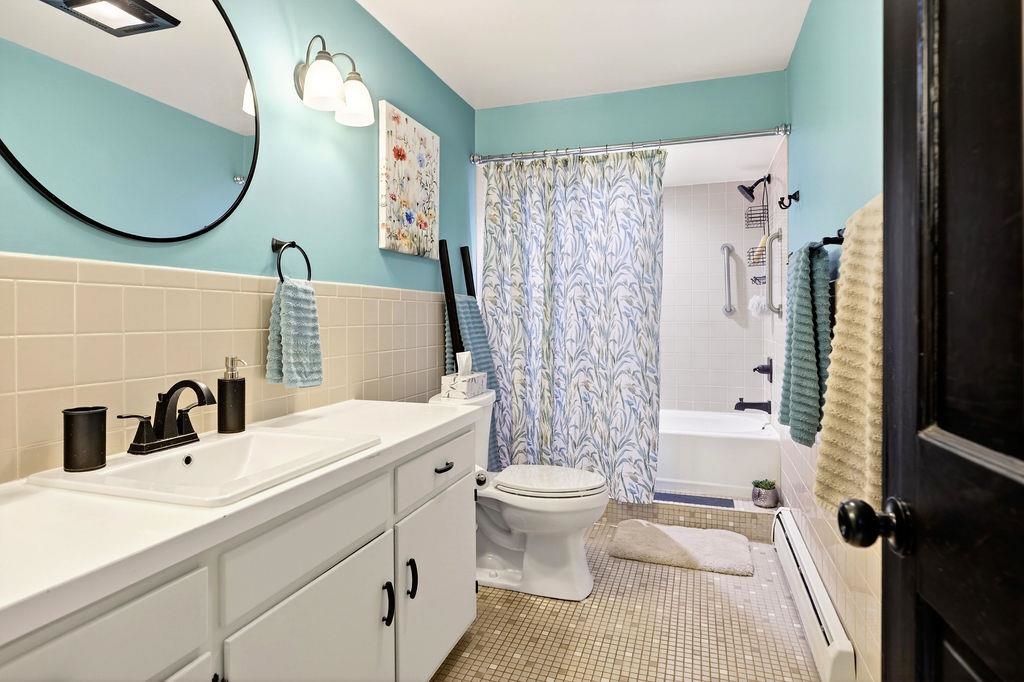 224 Meadowbrook Road Staunton, VA 24401 - Photo 33 of 59 a bathroom with a sink mirror toilet and shower