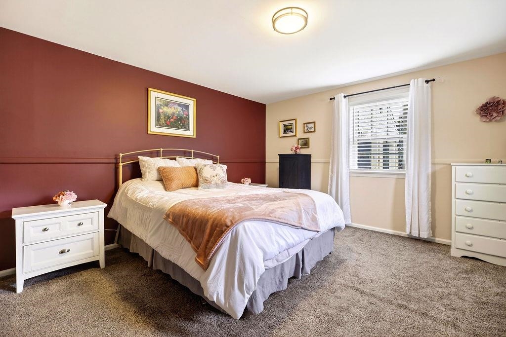 224 Meadowbrook Road Staunton, VA 24401 - Photo 34 of 59 a bedroom with a bed and a cabinets