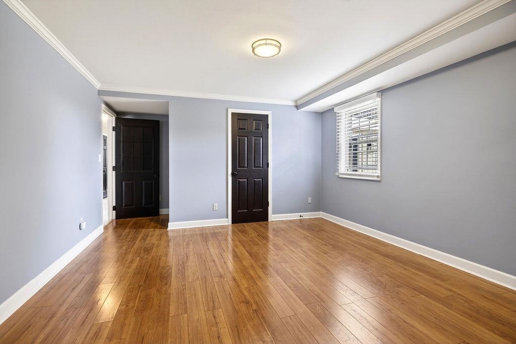 224 Meadowbrook Road Staunton, VA 24401 - Photo 43 of 59 an empty room with wooden floor and windows