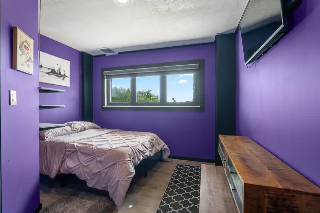 a view of a hallway with workspace and living room