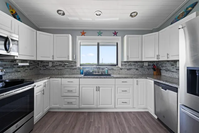 a bathroom with a sink and a shower curtain