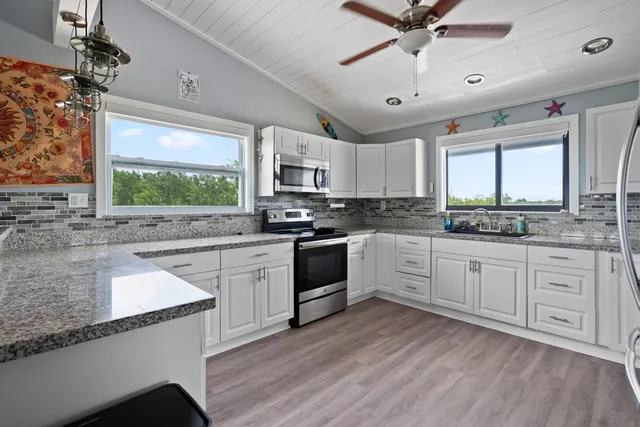 a view of porch with wooden floor