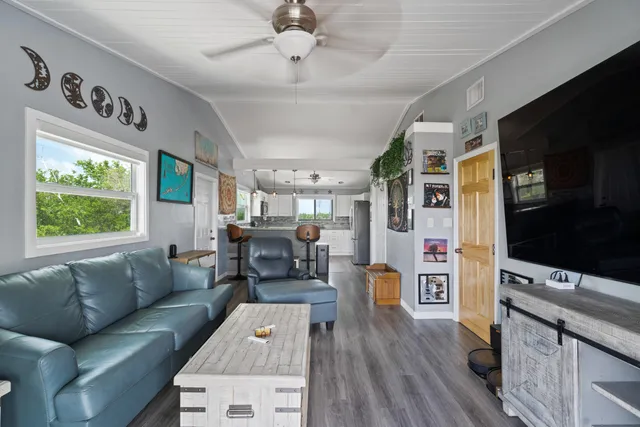 a view of a terrace with couches and potted plants