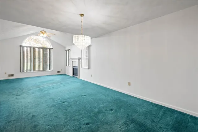 a view of a room with window wooden floor and a ceiling fan