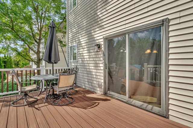 a view of balcony with furniture and wooden deck