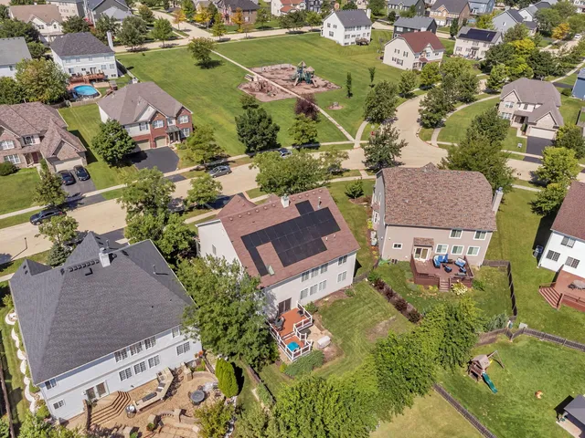 an aerial view of residential houses with outdoor space