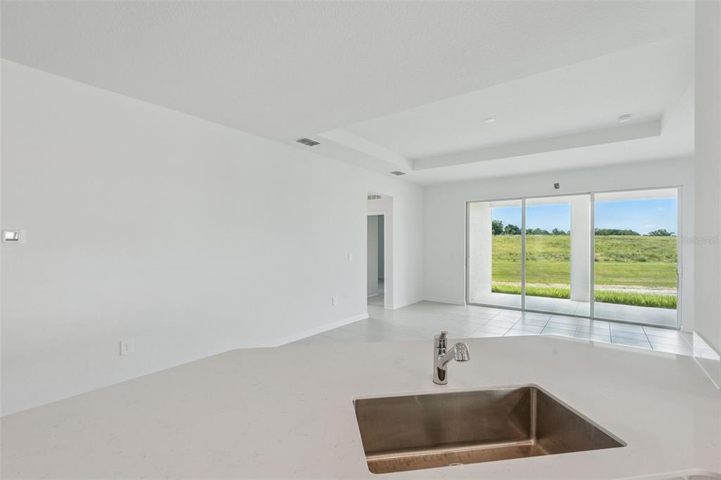 1672 Rider Rain Lane Apopka, FL 32703 - Photo 12 of 35 a kitchen with a sink and a window