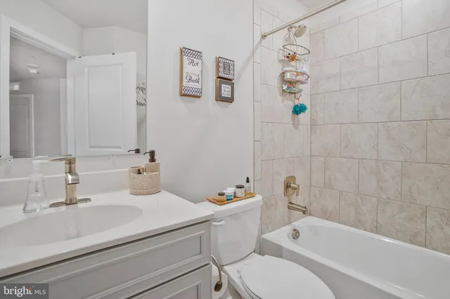 a bathroom with a sink a toilet and a bathtub