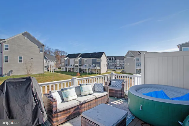 a balcony with table and chairs